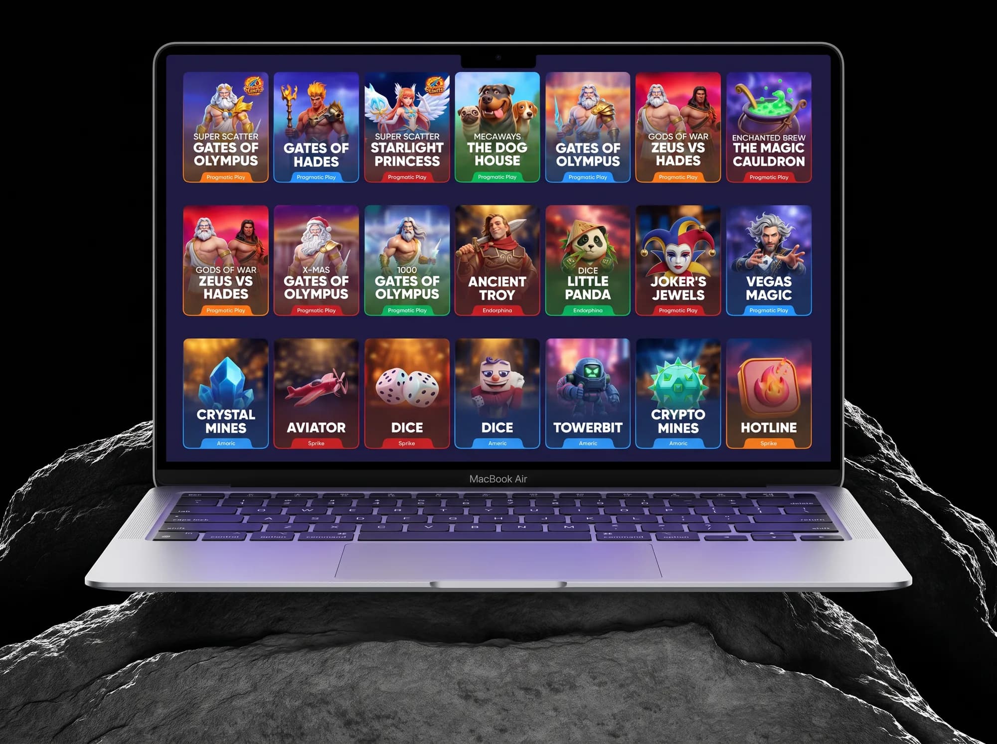 The game card wall on a MacBook Air on a rock, frontal